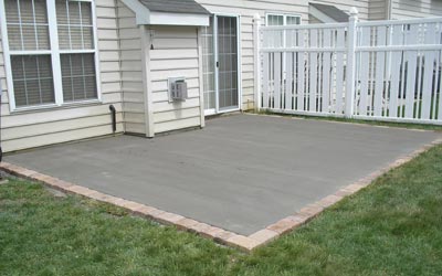 Newly poured concrete patio with EP Henry Paver border