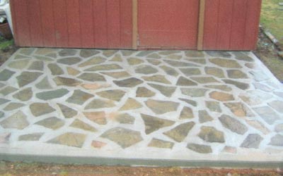 Concrete entry way with embedded slate pieces