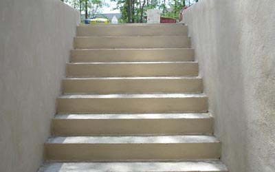 Concrete walkout basement, with stucco seal coat